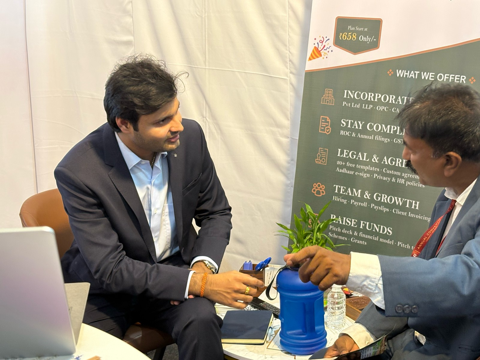 Founding Legals founder consulting with client at exhibition booth